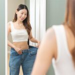 A young female celebrating weight loss